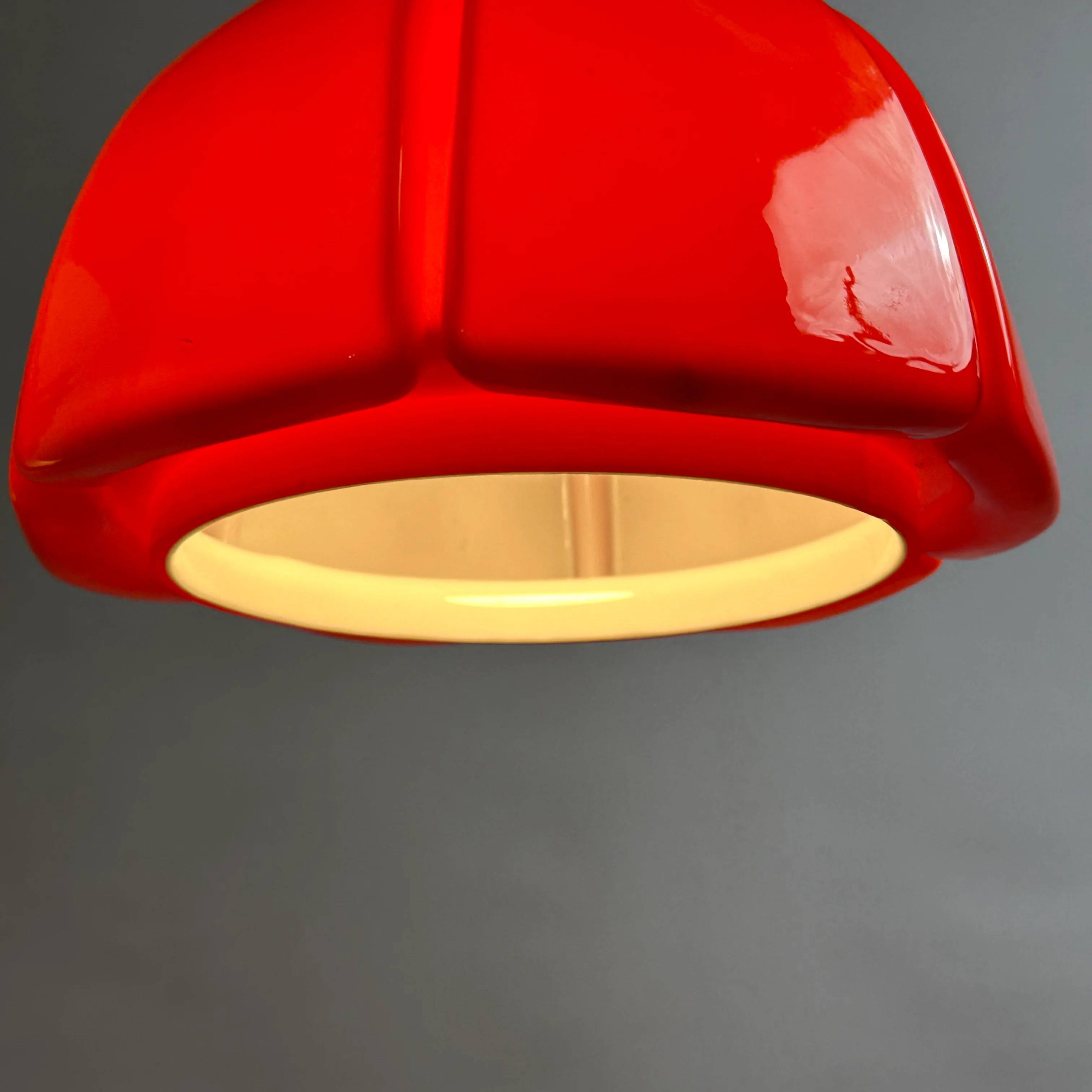 Red glass flower-shaped pendant by Glashütte Limburg.