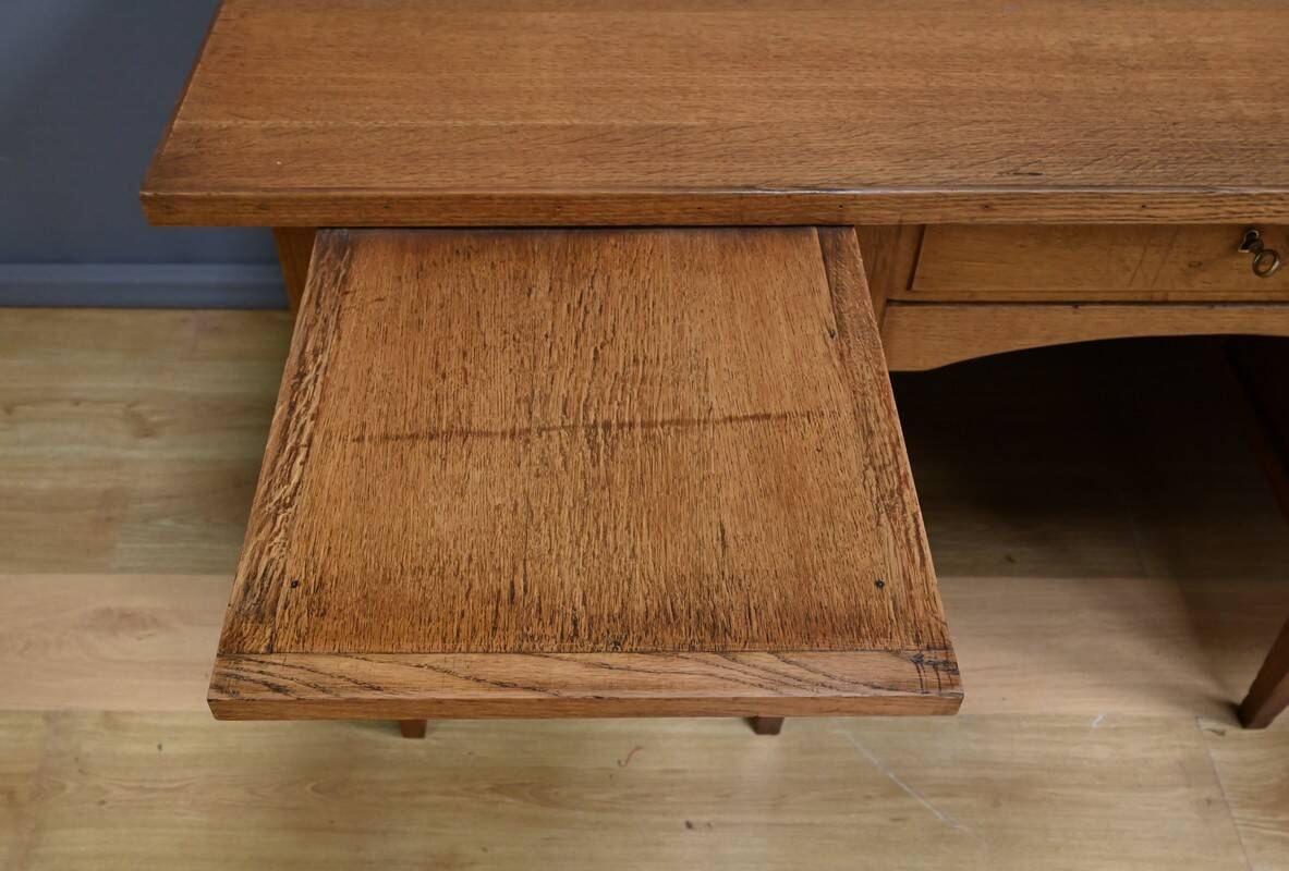 Solid oak pedestal desk, Régy establishments – 1940