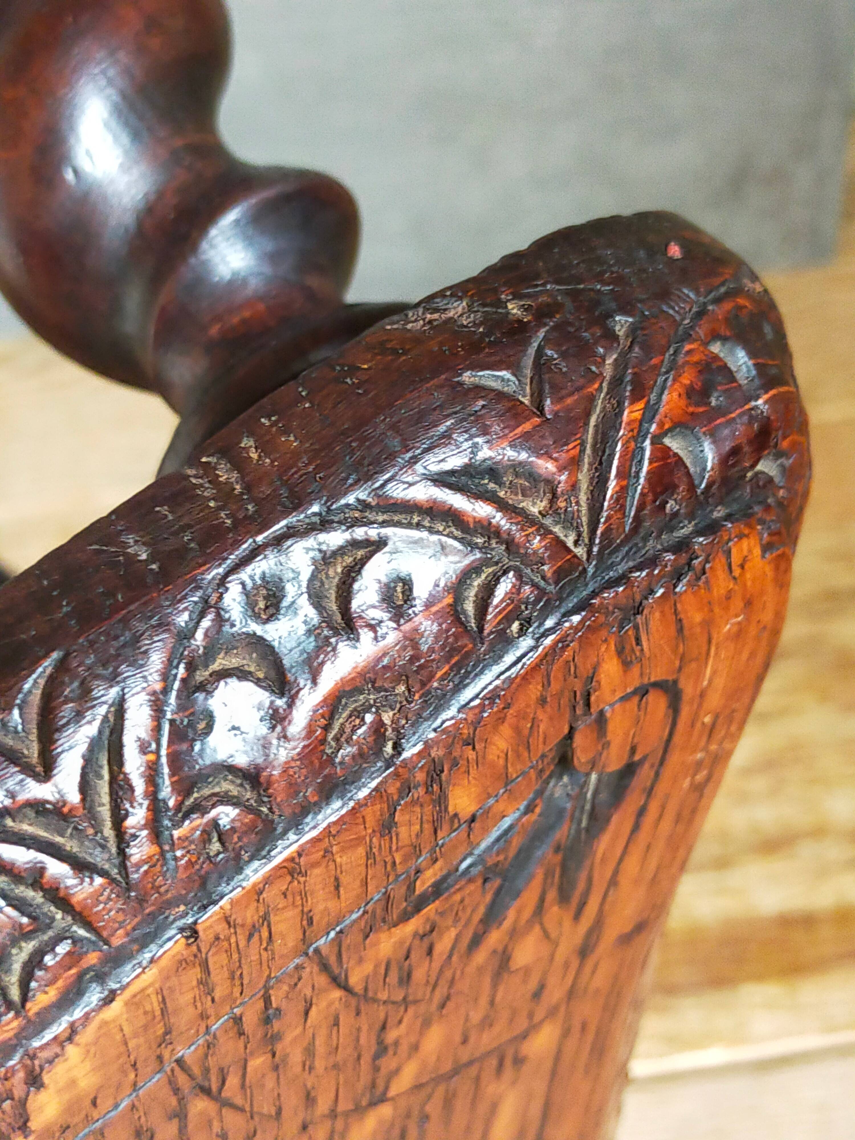 Antique stool in turned and carved solid wood