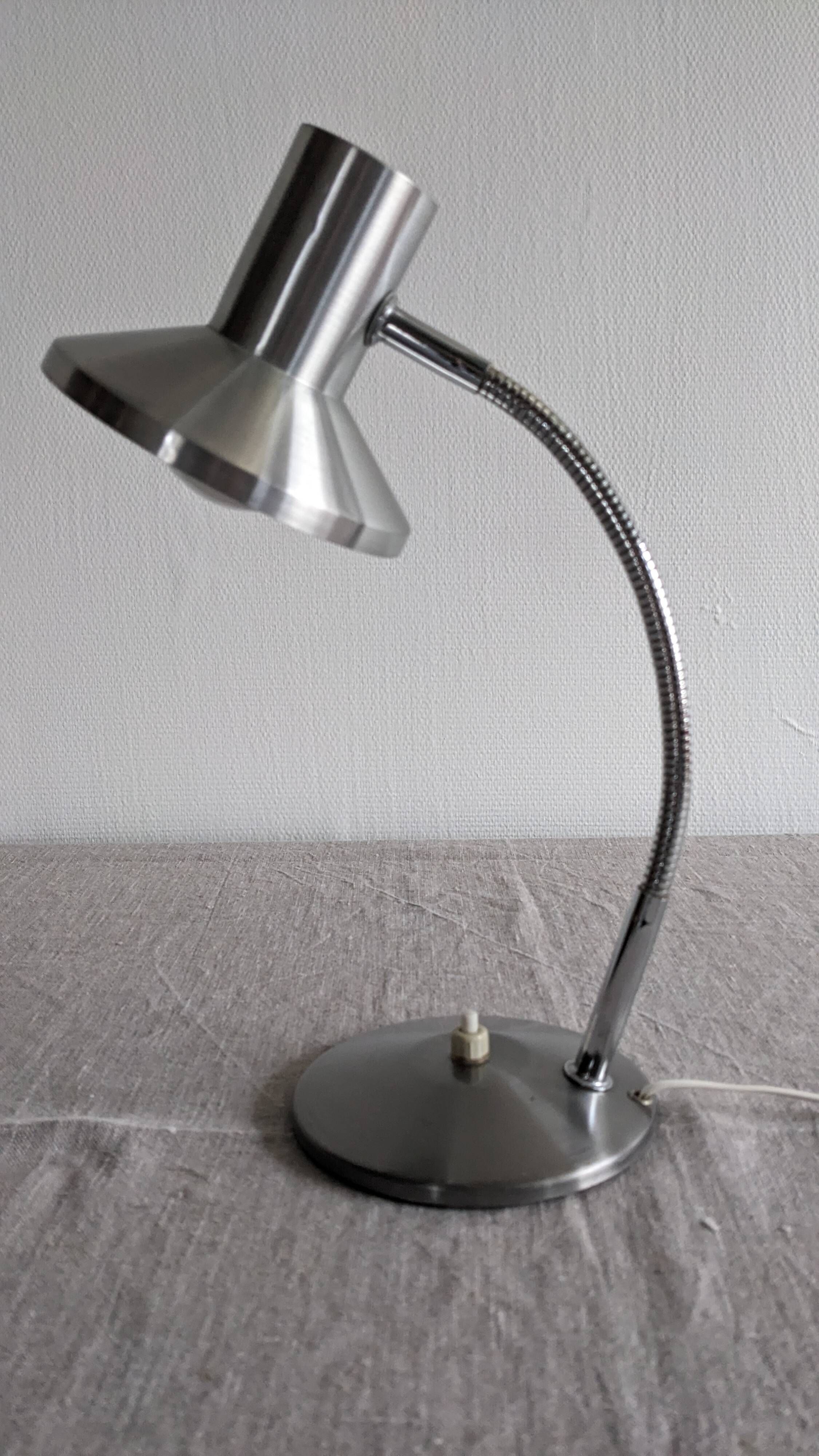 Articulated bedside lamp or wall light in aluminium, France circa 1960.