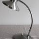 Articulated bedside lamp or wall light in aluminium, France circa 1960.