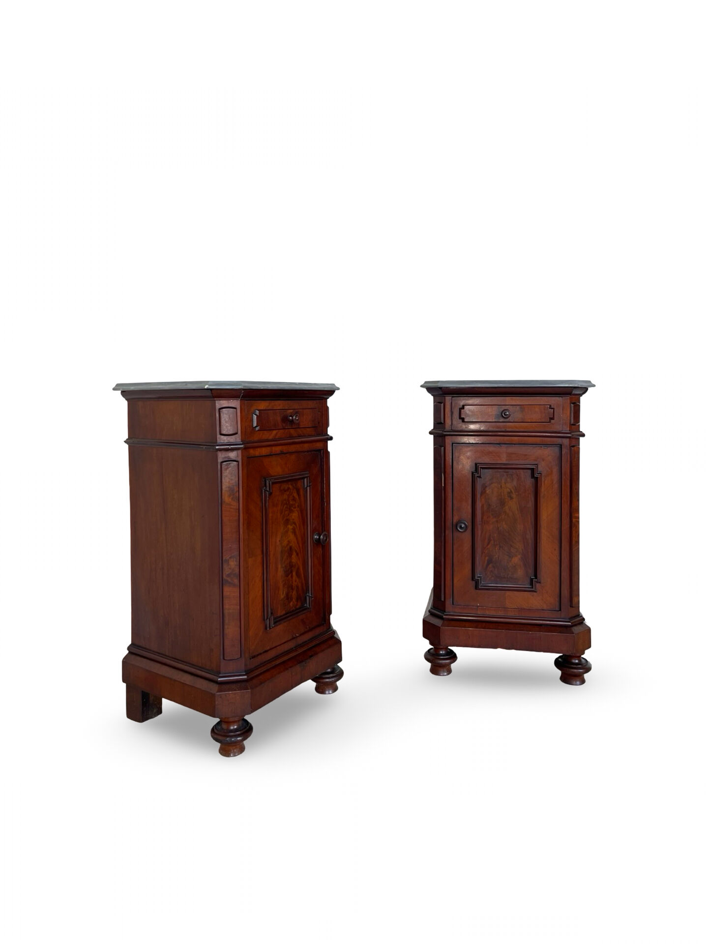 A pair of antique walnut bedside tables from the 1890s.