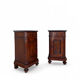 A pair of antique walnut bedside tables from the 1890s.