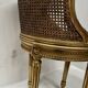Louis XVI style armchair in wood and gilded stucco, 20th century.