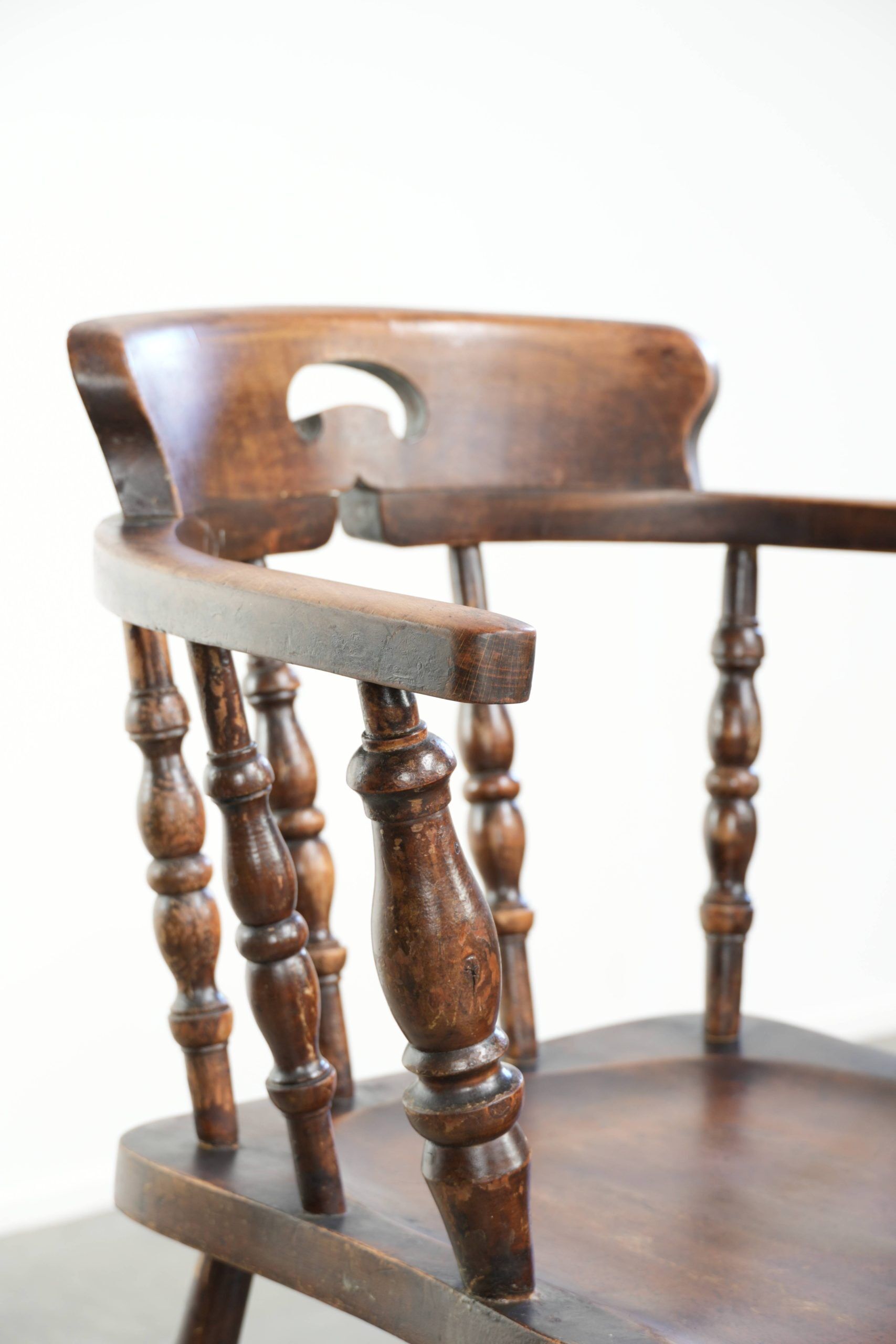 Wooden English antique pub/captain chair from the late 19th century