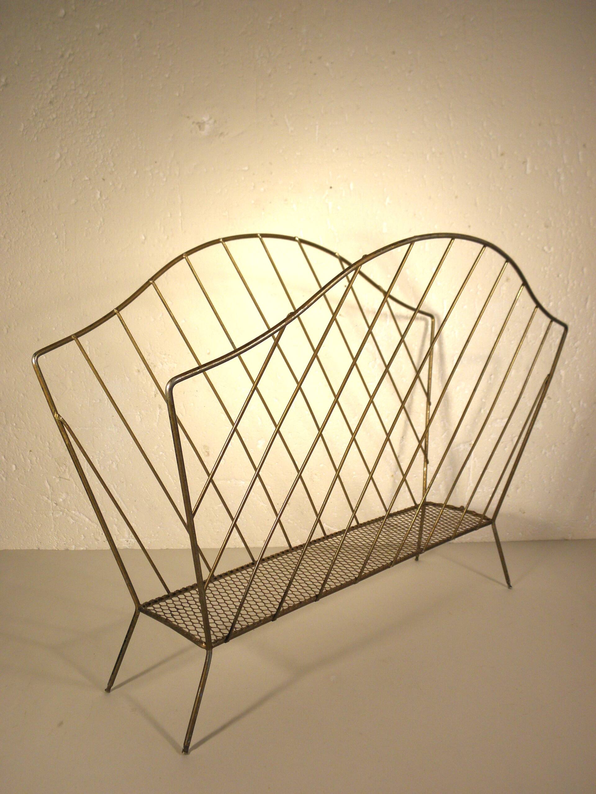 Golden metal magazine rack from the 60s