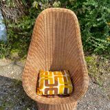 Rattan armchair and its cushion, 1960