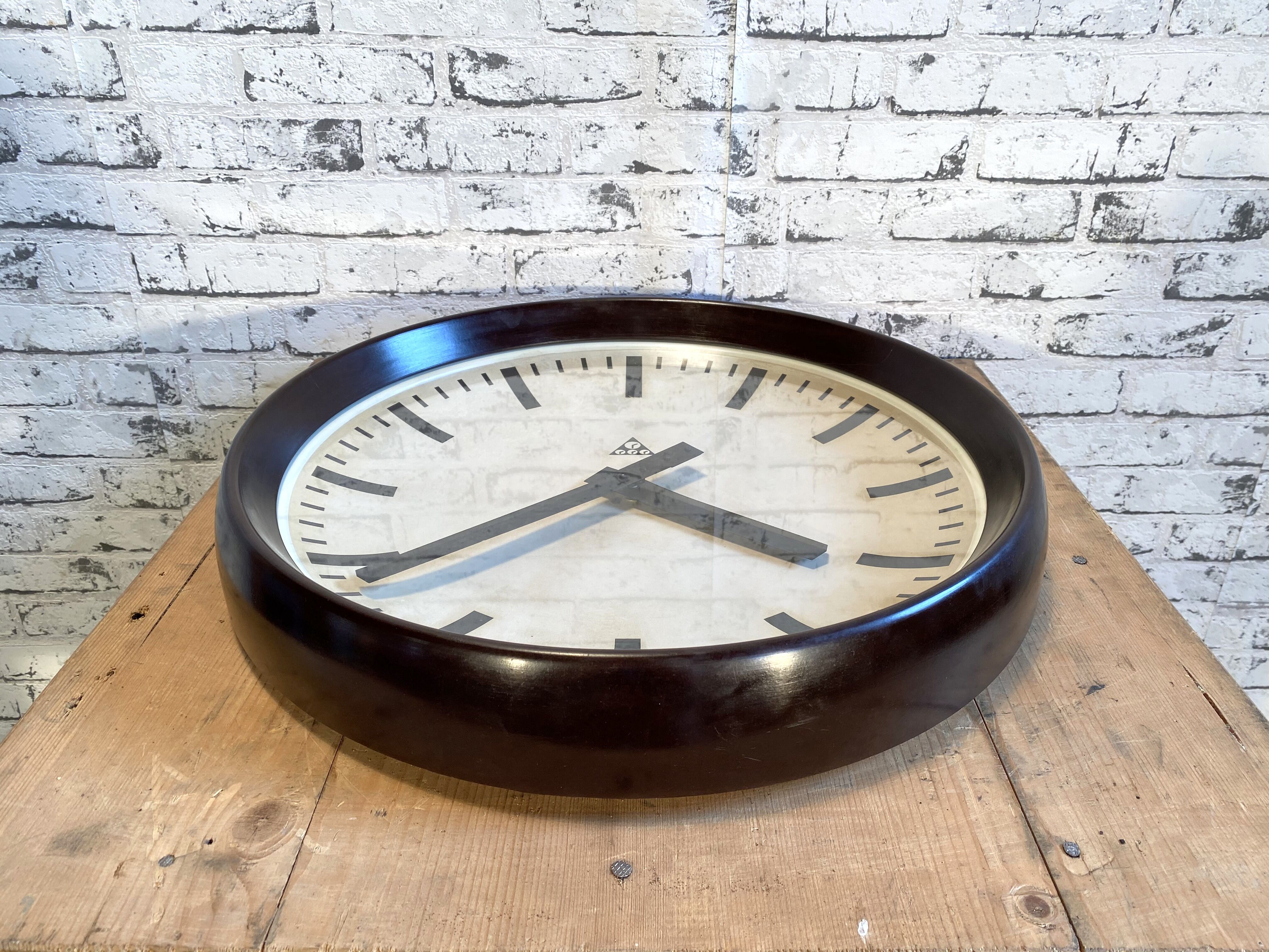 Industrial bakelite factory wall clock from Pragotron, 1960s