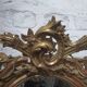 Golden oval mirror