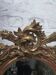 Golden oval mirror