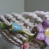 Cup on woven ceramic base with slip flowers