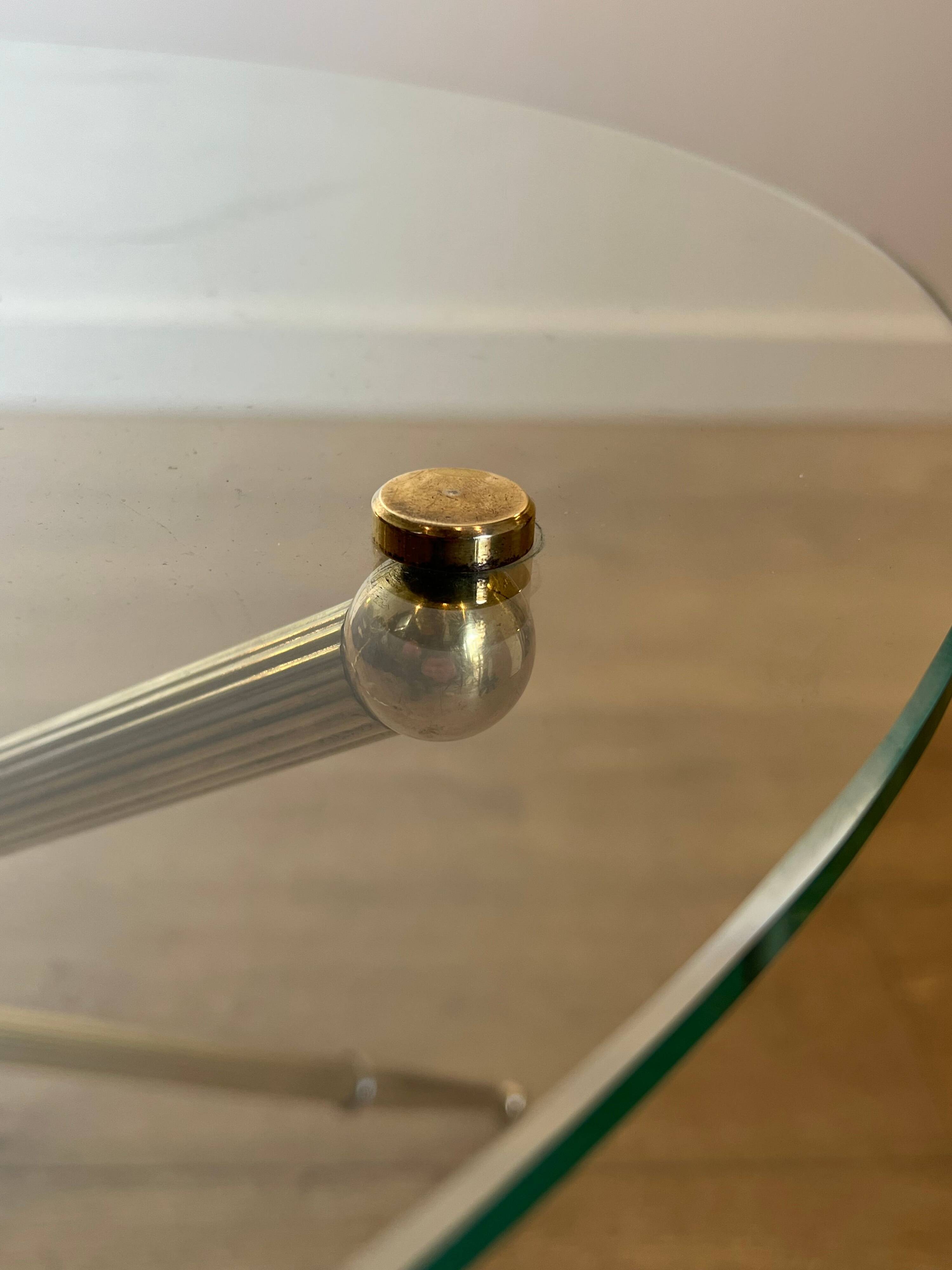 Round tripod designer coffee table in brass