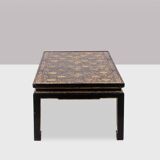 Lacquer coffee table decorated with floral motifs. Circa 1900.