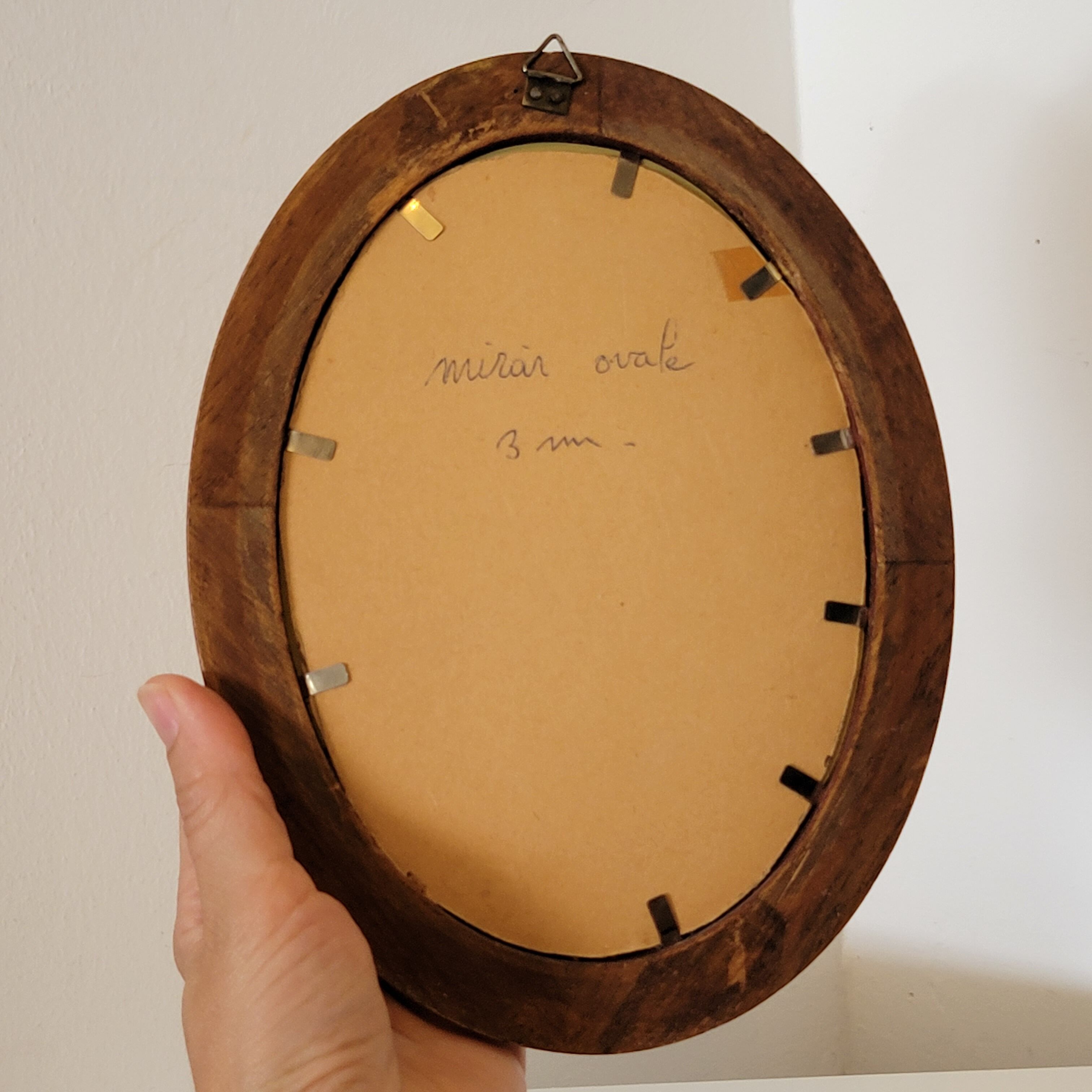 Old small oval mirror gilded wooden frame 22 X 17 X 2 cm.