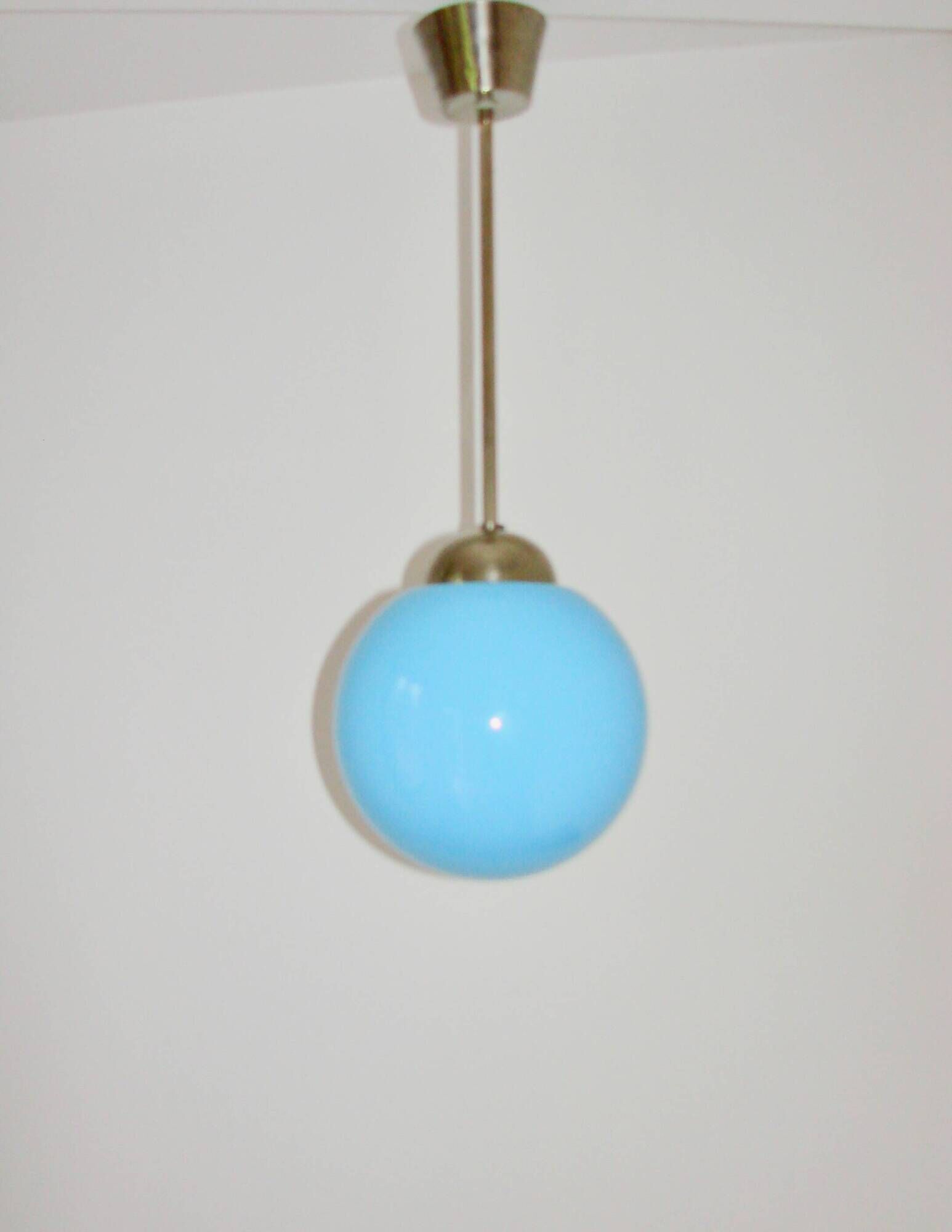 A pendant lamp with a blue glass shade, 1940s.