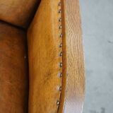 Cognac-colored sheepskin and wooden Art Deco design armchair