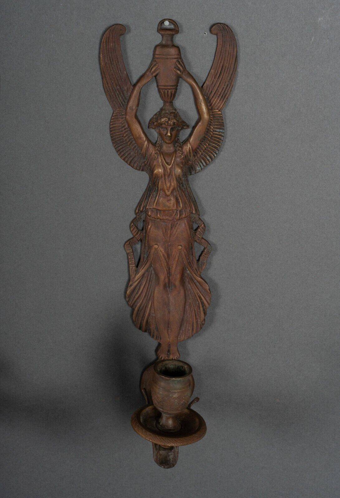 Pair of Empire period bronze sconces decorated with a winged woman