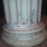 Column topped with a plaster basin.