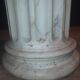 Column topped with a plaster basin.