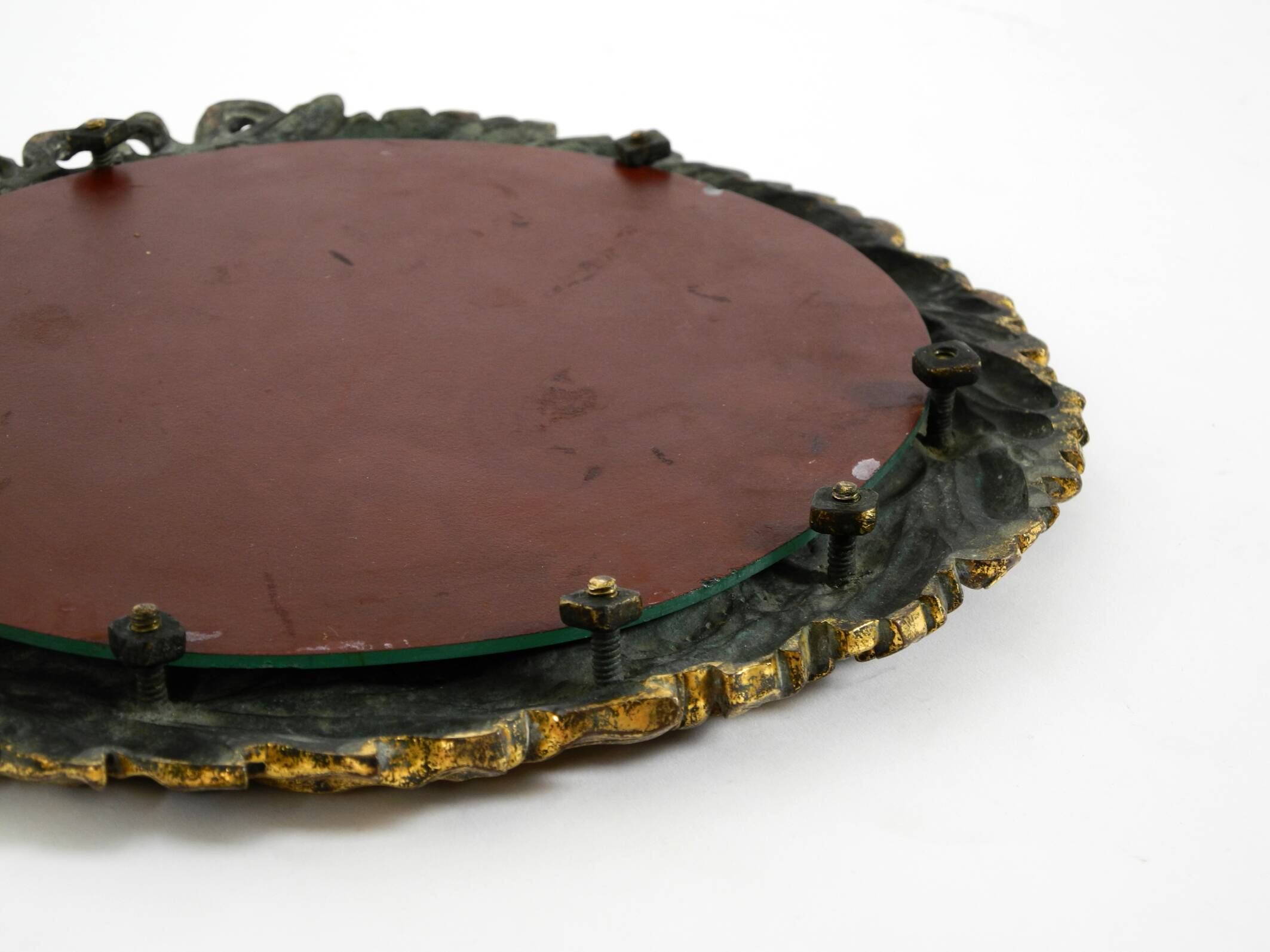 Beautiful small French mid-century wall mirror with an ornate brass frame