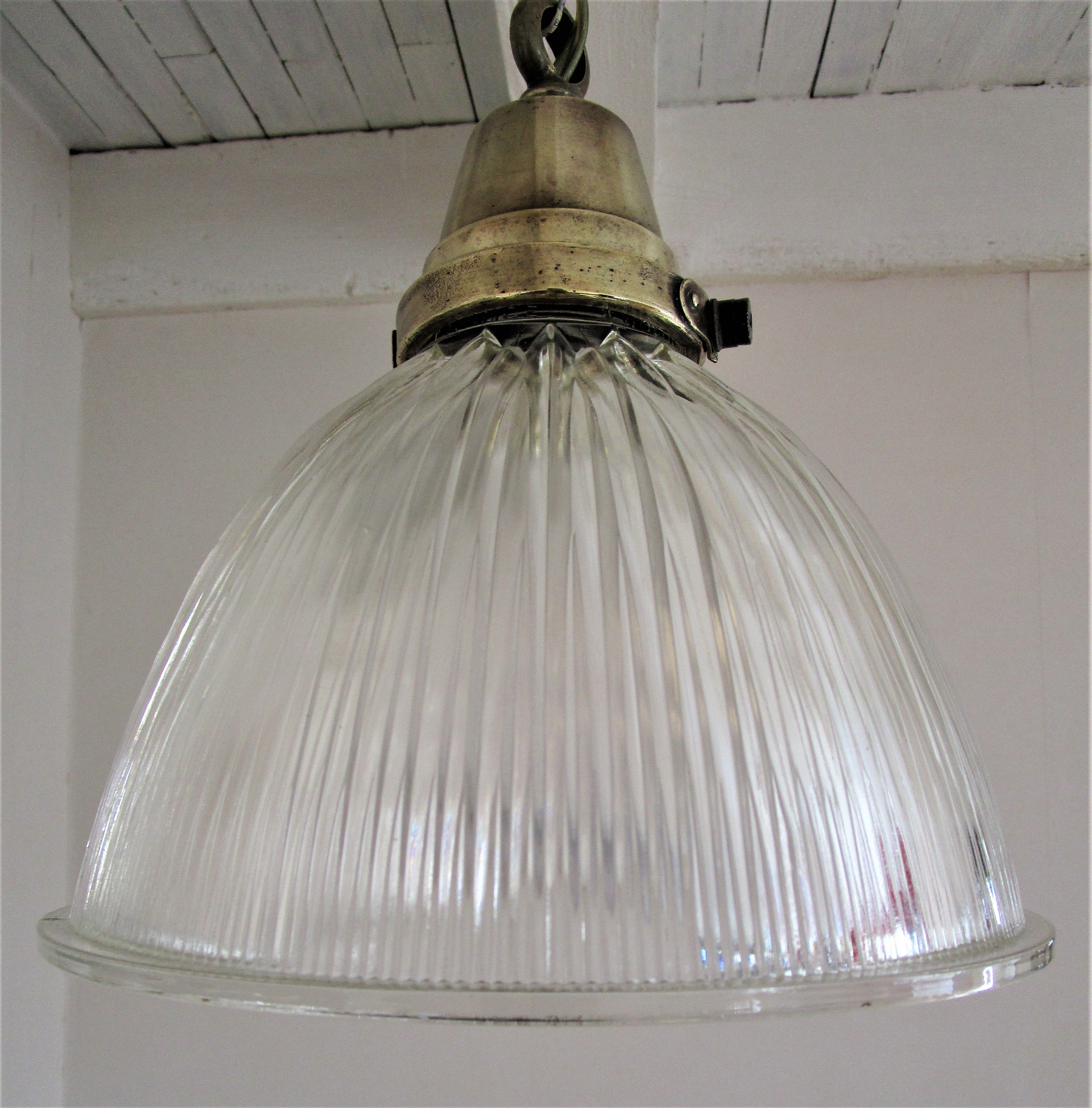 Holophane glass suspension and vintage patinated brass