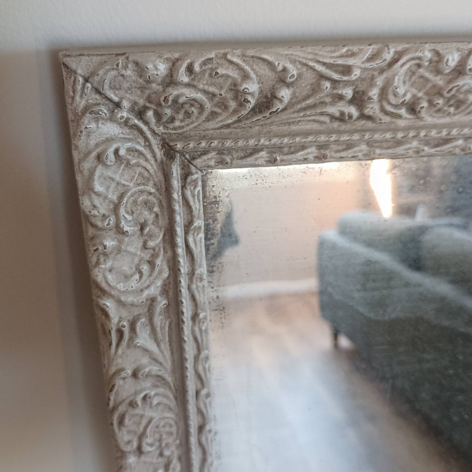 Antique mirror in carved, painted and patinated wood