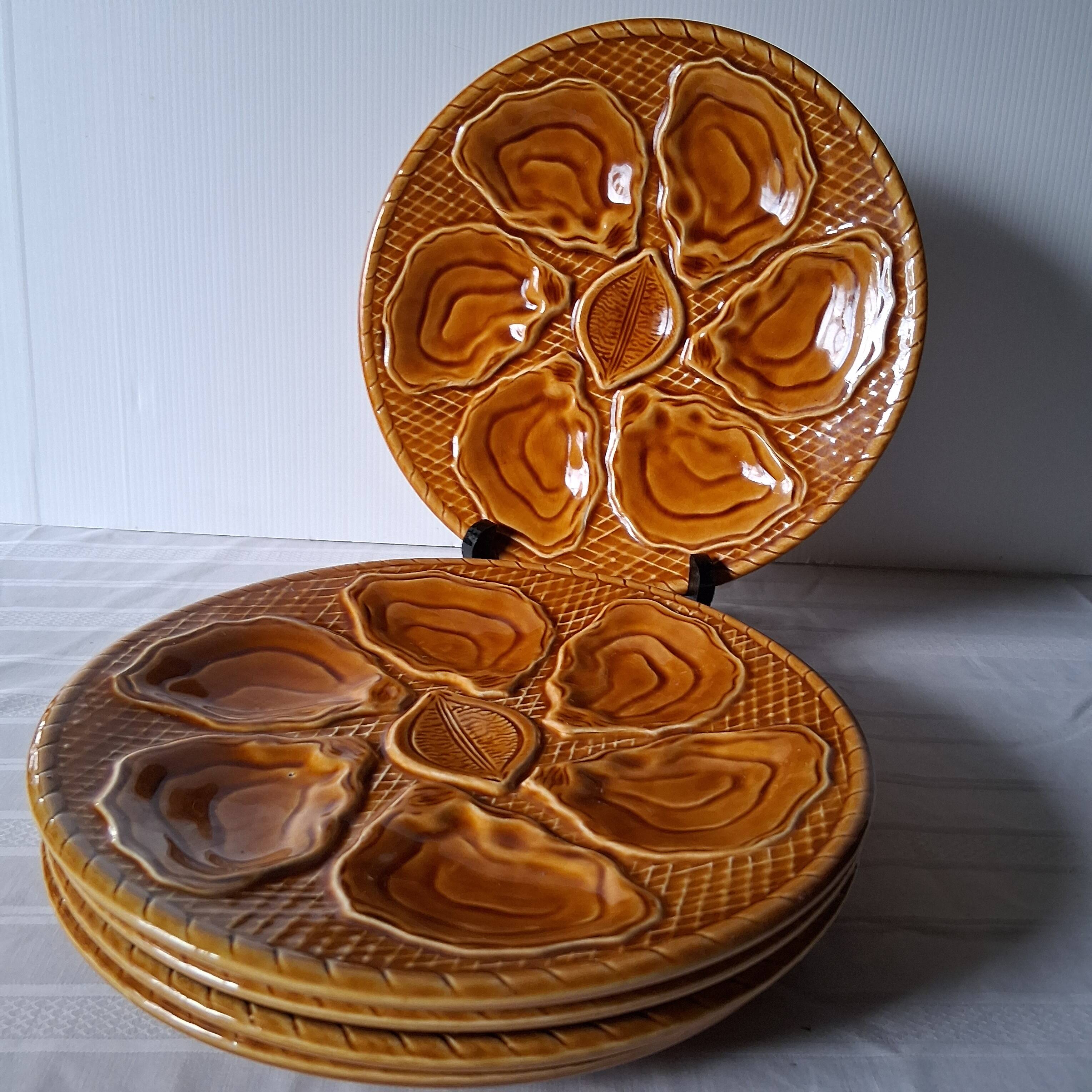 5 oyster or brown shell plates in good condition