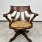 Swivel office chair in oak with a rattan seat.