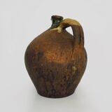 Old goat, jug, gargoulette, water pitcher in glazed green sandstone. nineteenth century