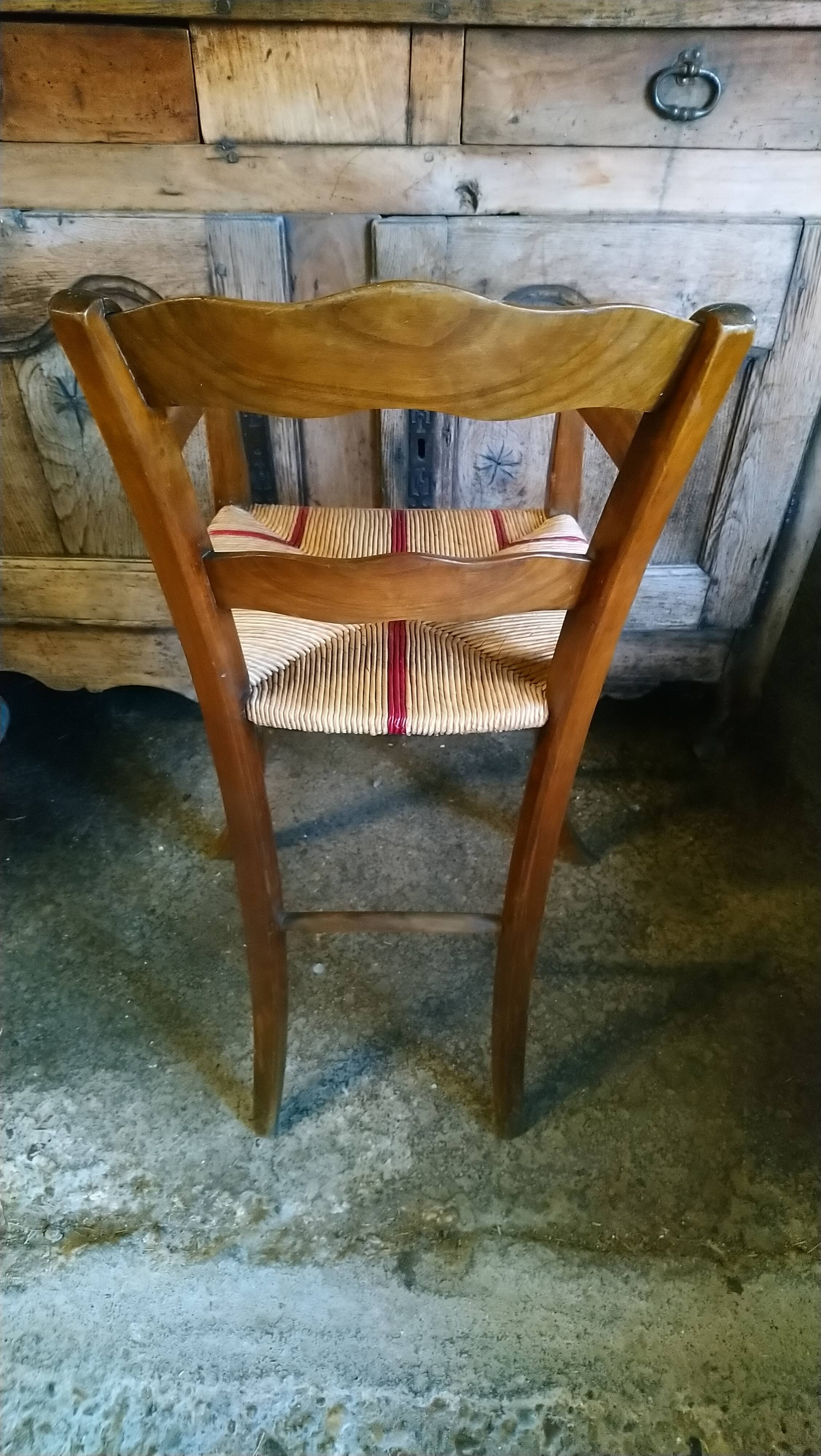 Child's high chair with a rush seat in walnut