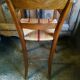 Child's high chair with a rush seat in walnut