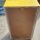 Yellow wooden chest of drawers