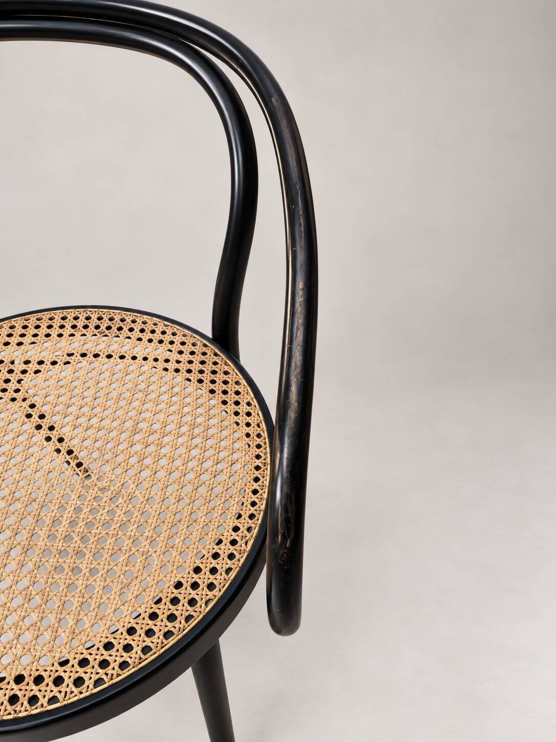 Thonet armchair in bent wood and caning – Czechoslovakia
