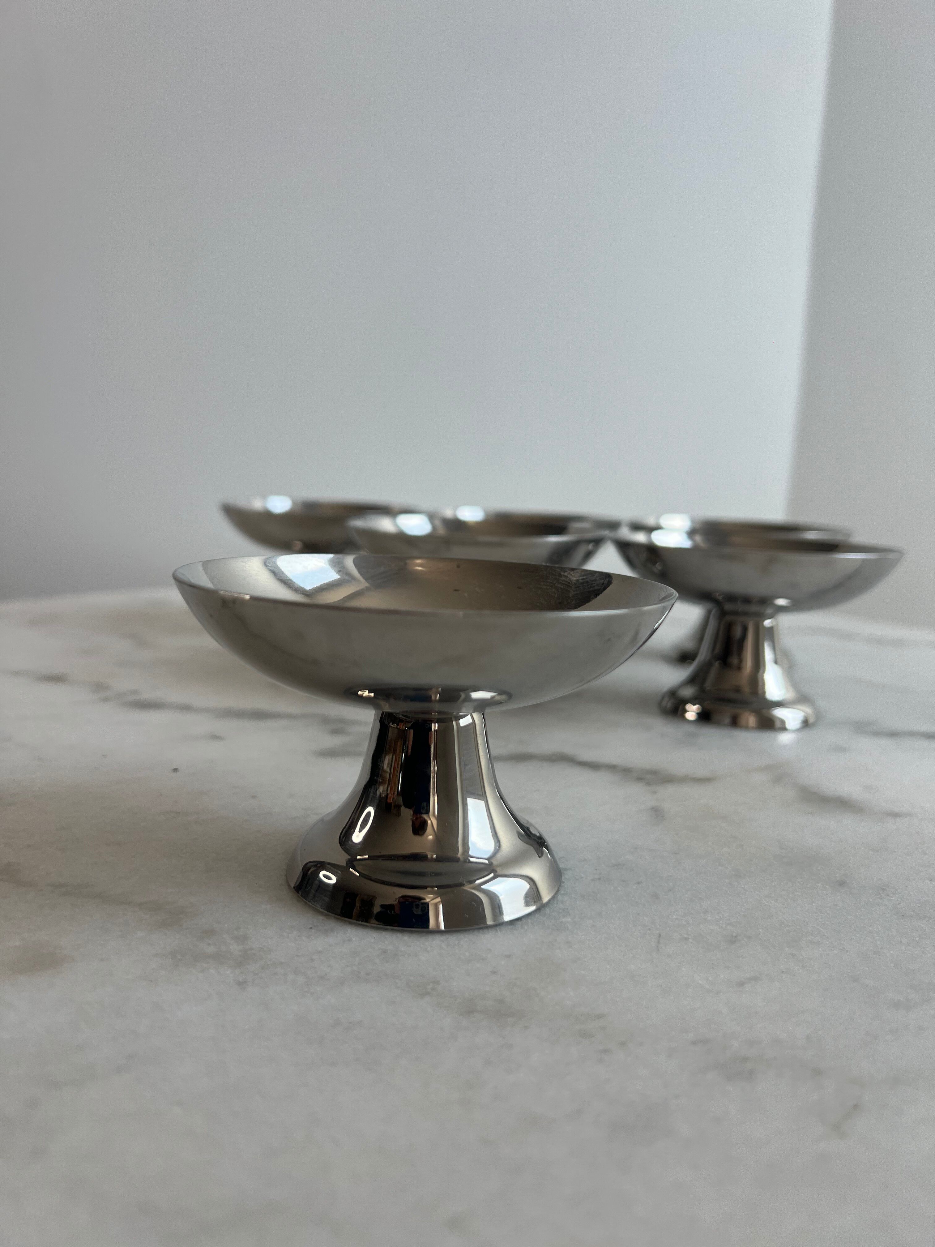 Set of 6 stainless steel dessert bowls on a stand.