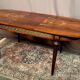 Louis XVI style oval dining table with rosewood marquetry extension mounted in bronze