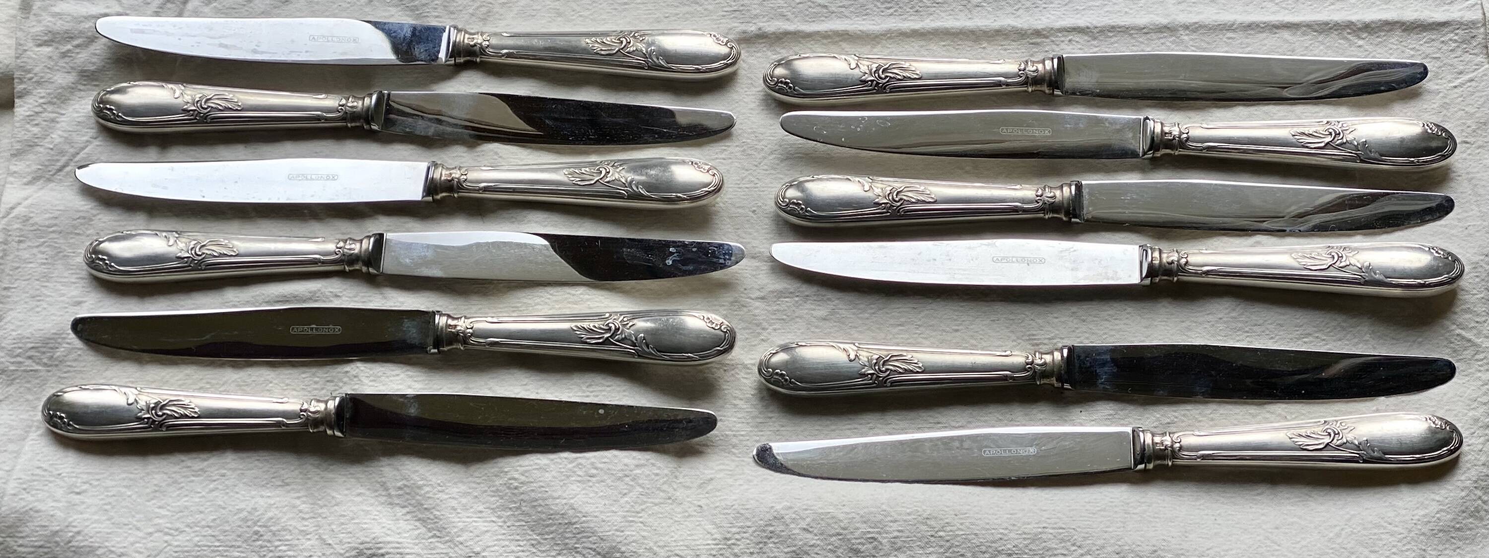 Set of 12 silver-plated metal table knives in Art Nouveau style.