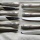Set of 12 silver-plated metal table knives in Art Nouveau style.