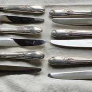 Set of 12 silver-plated metal table knives in Art Nouveau style.