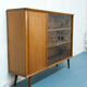 Console with sliding doors