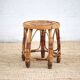 Vintage bamboo stool, woven rattan plant stand, interior decoration.