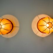 Pair of "cocoon" wall lights, resin and pine, Italy, 1970