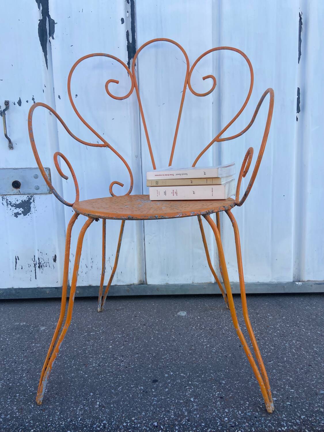 Orange wrought iron chair