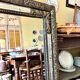 Rectangular Napoleon III mirror in moulded black and gold wood with engraved mirror decoration.