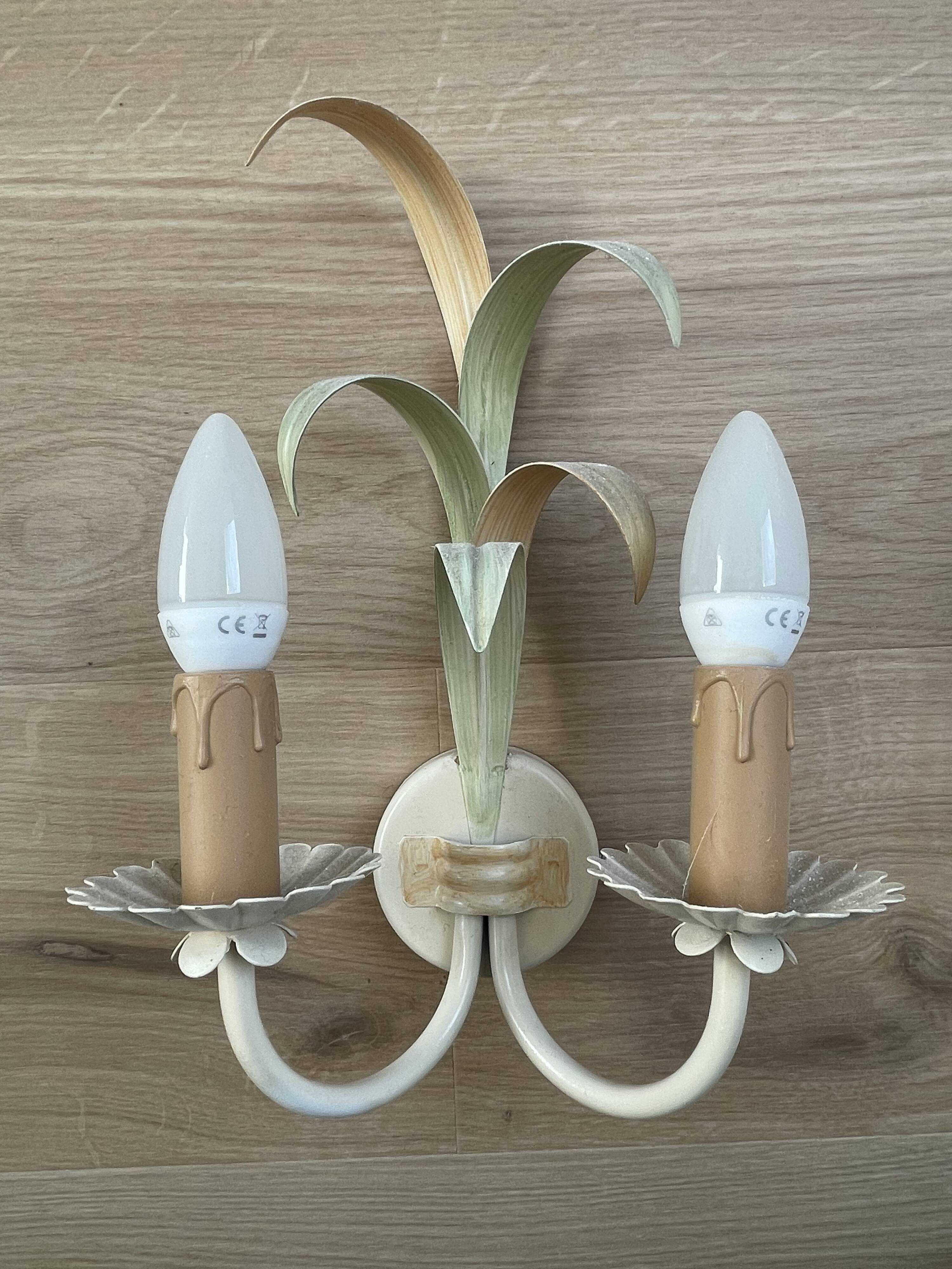 Vintage wrought iron wall sconce in the shape of a flower/leaf