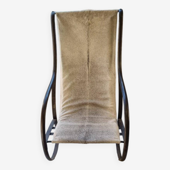 Wrought iron and skin armchair