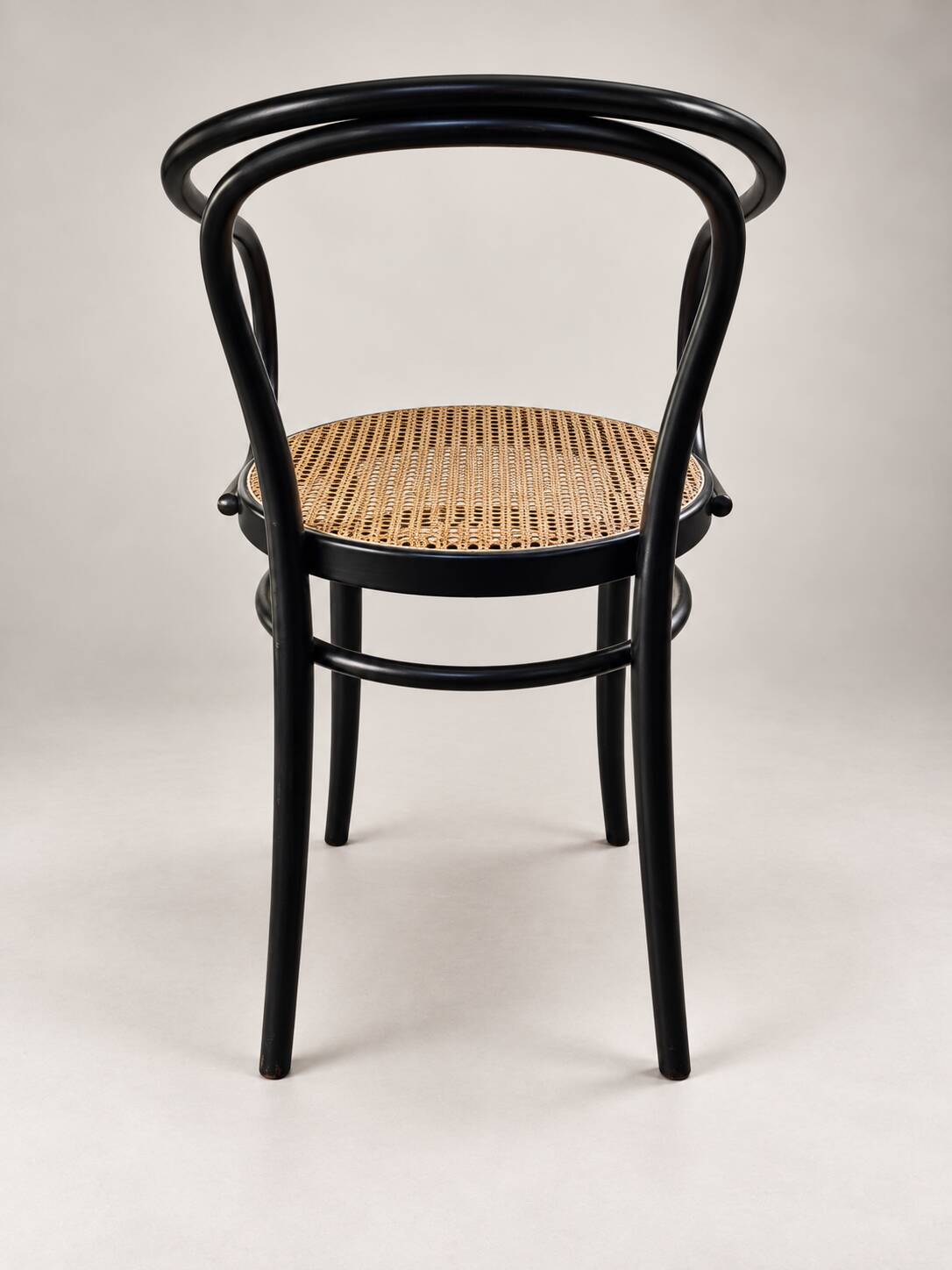 Thonet armchair in bent wood and caning – Czechoslovakia