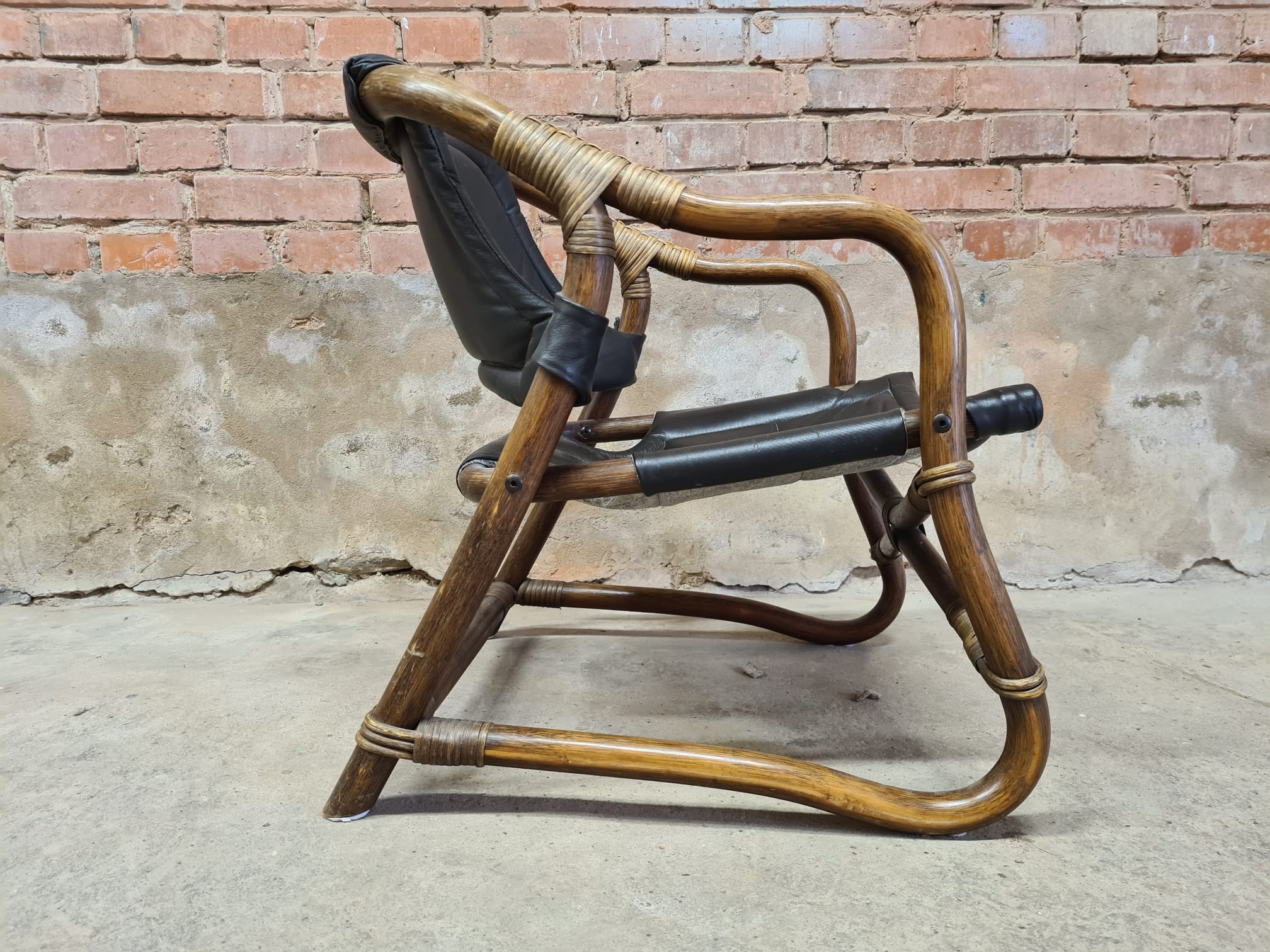 Pair of vintage skaï bamboo armchairs