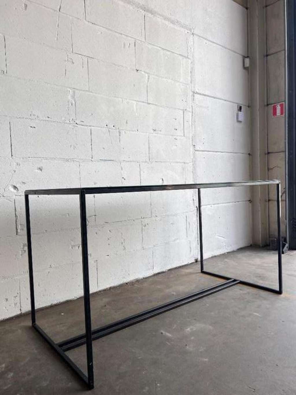 Coffee table in glass and iron