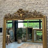 Pedimented mirror 184.5cm/135cm gilded with gold leaf