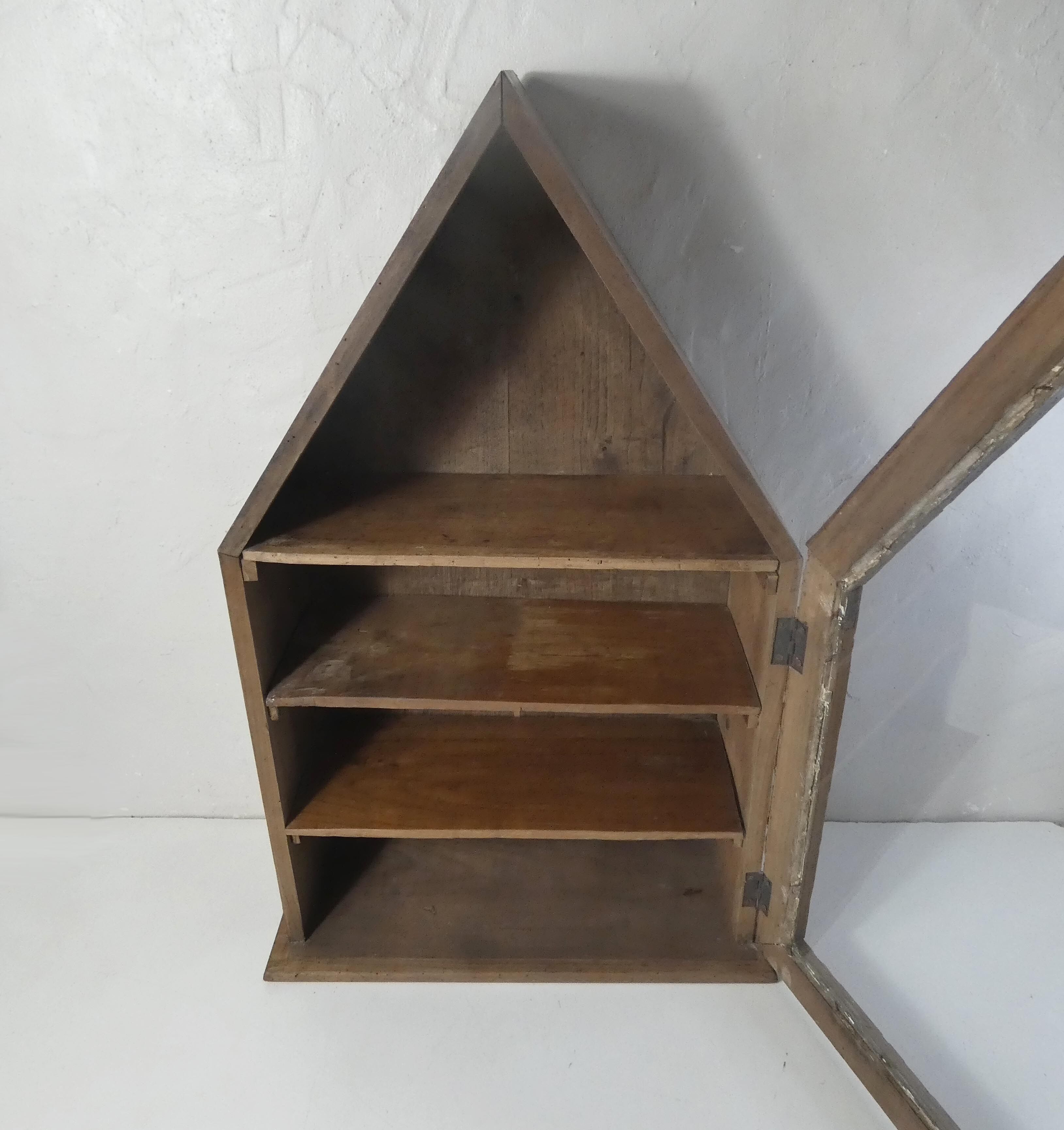 Old niche shelf with glazed statue